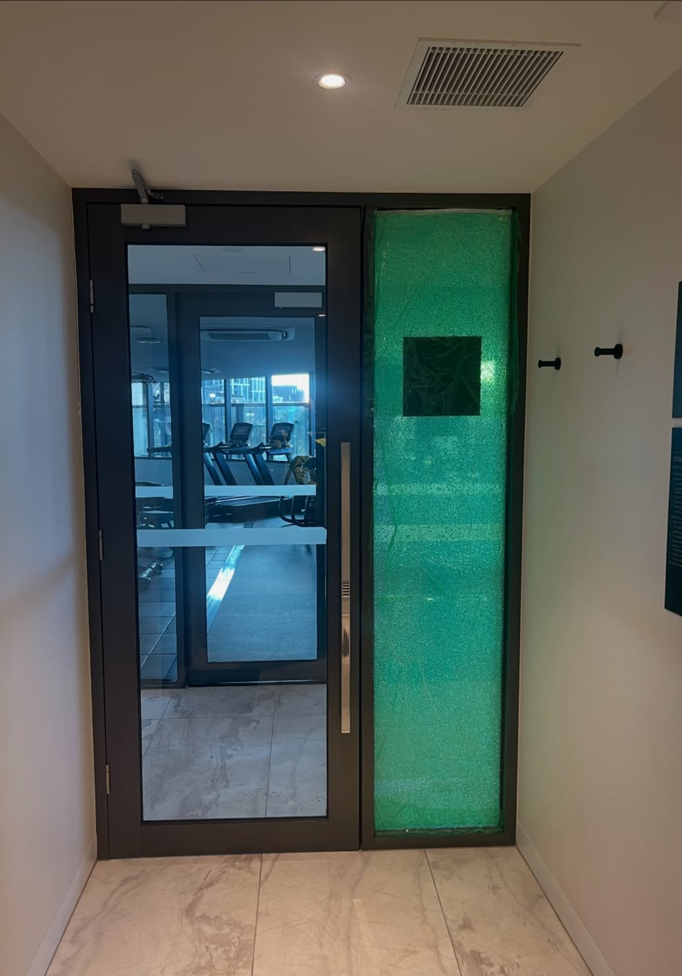 Commercial glass door and framed sidelight installation in Melbourne