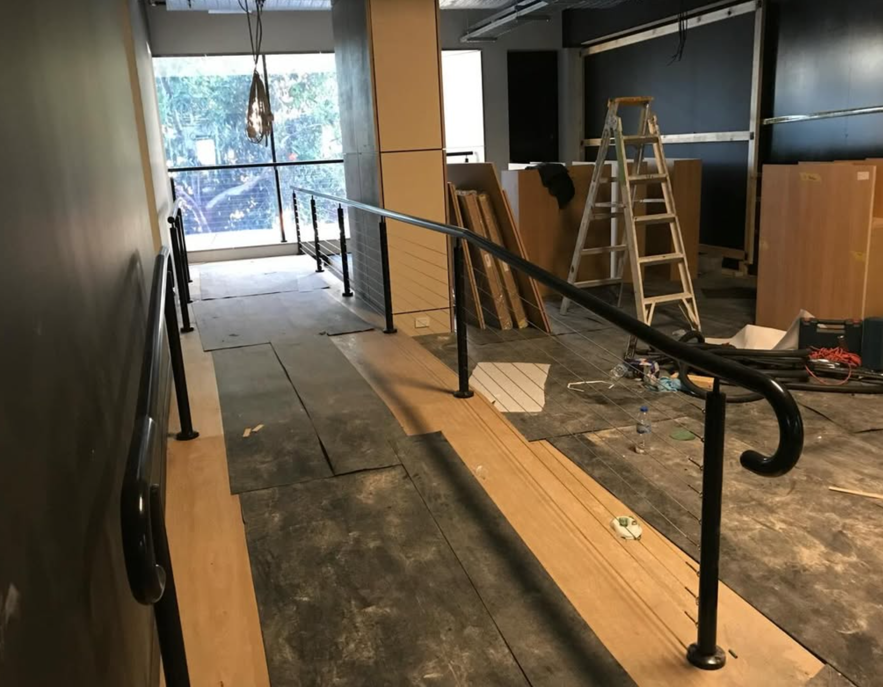 Stainless steel wire balustrade and handrail in commercial fitout